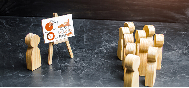 Professionals in collaborative meeting reviewing documents